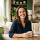 A smiling woman in a bright, modern home setting, representing a satisfied customer.